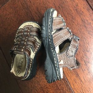 The children place baby sandals